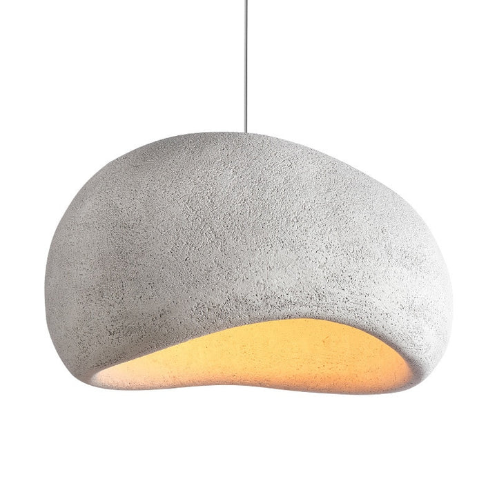 Nula Cloud pendant light hanging in a white room, emitting soft, diffused light