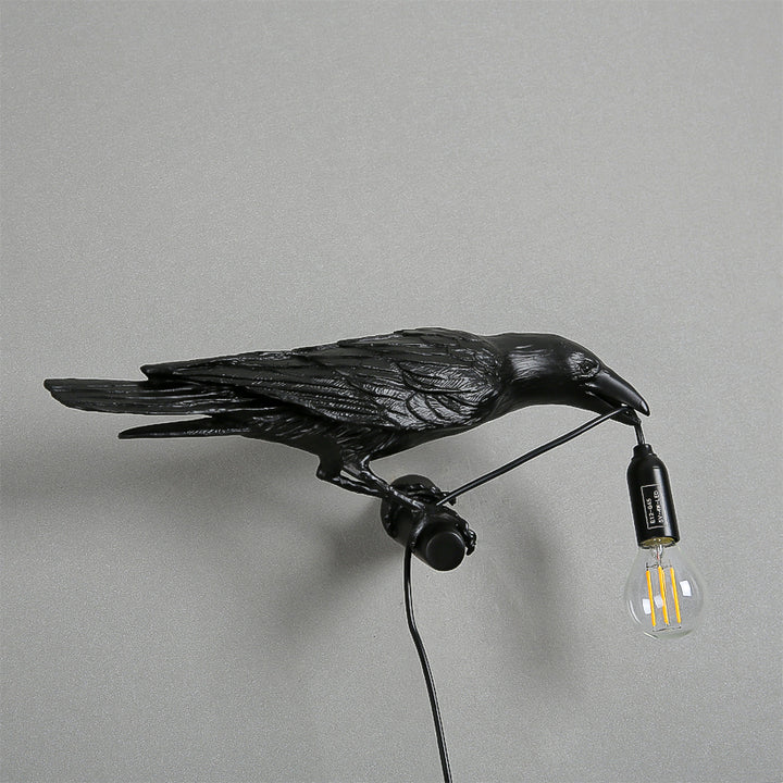 A shot of the Raven Lamp in a study, adding a touch of sophistication and charm.
