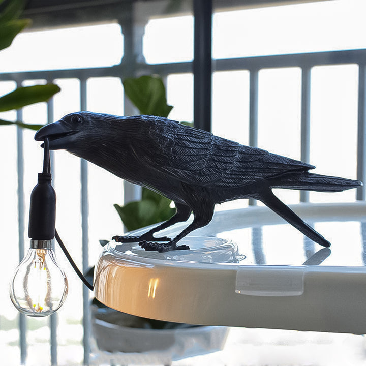 A shot of the Raven Lamp in a living room, showcasing its sleek and modern design.