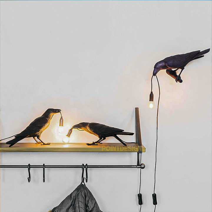 A shot of the Raven Lamp in a bedroom, adding a touch of nature-inspired charm to the space.