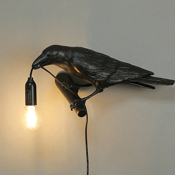 A photo of the Raven Lamp in a home library, providing functional and stylish lighting.